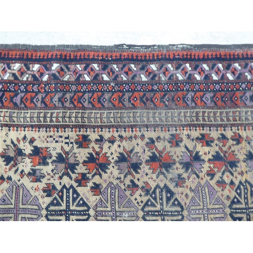 101 - A Turkoman runner, decorated with a central column of fourteen guls, bordered by stylised designs, o... 