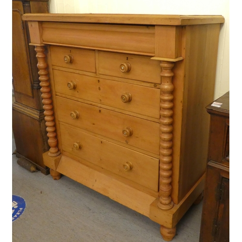 102 - An early 20thC Scottish design, bleached pine six drawer dressing chest, on a plinth and turned feet... 