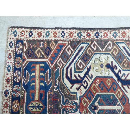 115 - A Turkish Kilim style runner, decorated with repeating stylised designs, on a multi-coloured gr... 