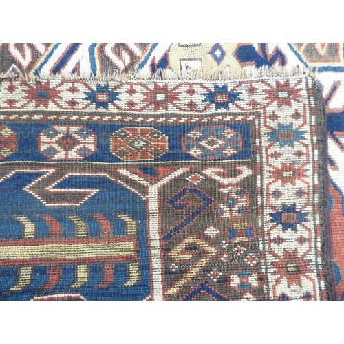 115 - A Turkish Kilim style runner, decorated with repeating stylised designs, on a multi-coloured gr... 