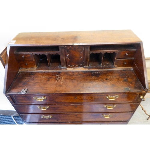 117 - A George III mahogany bureau, the fall flap, over four graduated drawers, raised on turned feet  42