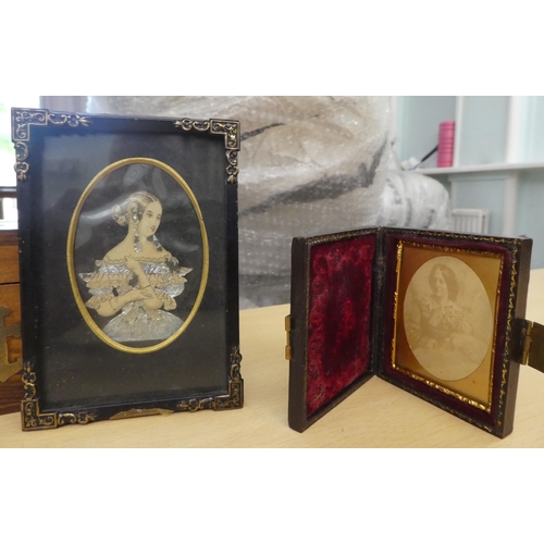 14 - A mixed lot: to include a late Victorian mahogany hand mirror with an inset floral embroidered panel... 