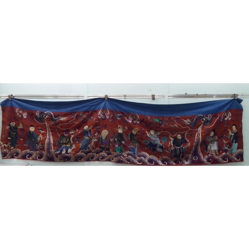 209 - An early 20thC Chinese embroidered tapestry, depicting figures  120