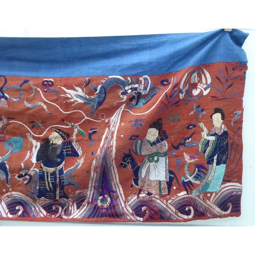 209 - An early 20thC Chinese embroidered tapestry, depicting figures  120