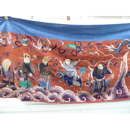 209 - An early 20thC Chinese embroidered tapestry, depicting figures  120