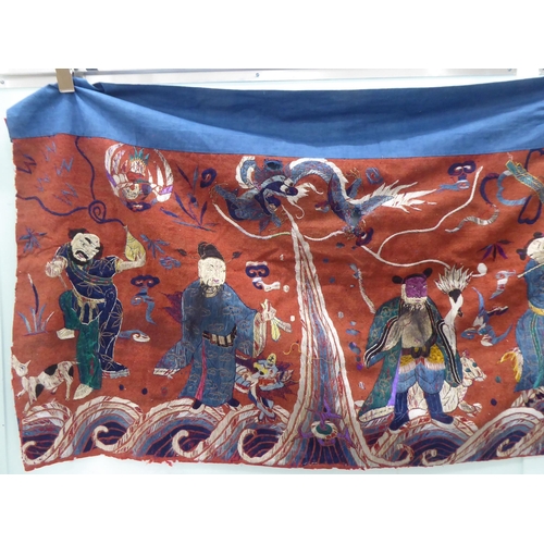 209 - An early 20thC Chinese embroidered tapestry, depicting figures  120