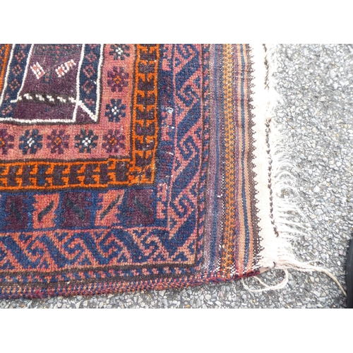 222 - Four dissimilar rugs: to include a Turkoman, on a red ground  34