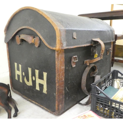 241 - An early 20thC hide bound canvas cabin trunk with a domed lid and straight sides and a removable tra... 