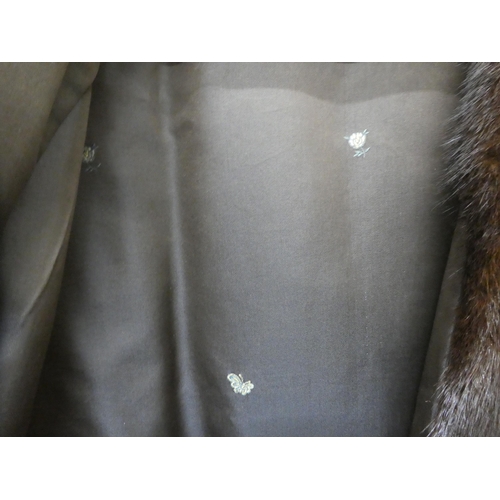 25 - A black mink fur coat; and a jacket 