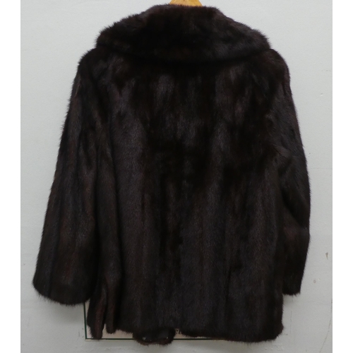 25 - A black mink fur coat; and a jacket 