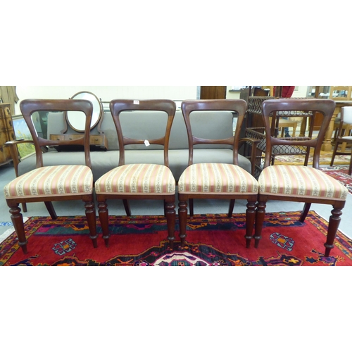 257 - A set of four Edwardian mahogany framed bar back dining chairs, the later fabric upholstered cushion... 