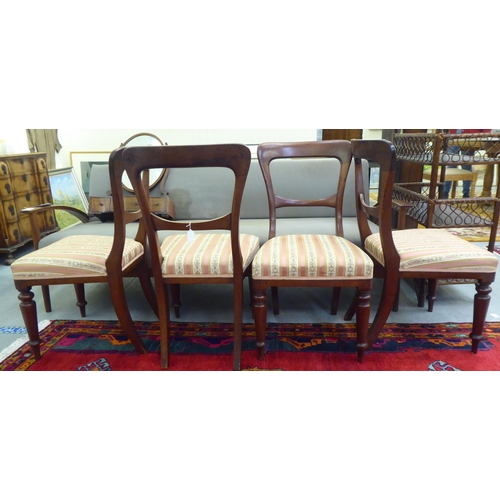 257 - A set of four Edwardian mahogany framed bar back dining chairs, the later fabric upholstered cushion... 