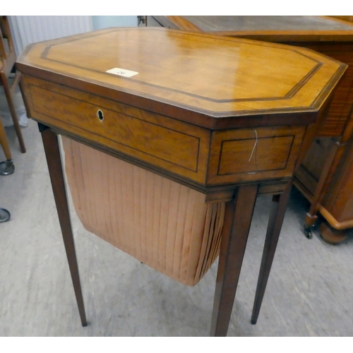 26 - A Regency marquetry inlaid, satinwood sewing table of octagonal form with a hinged lid and a linen b... 