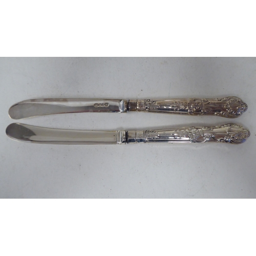 261 - Two sets of six loaded silver handled butter knives  both boxed; and one single  mixed mar... 