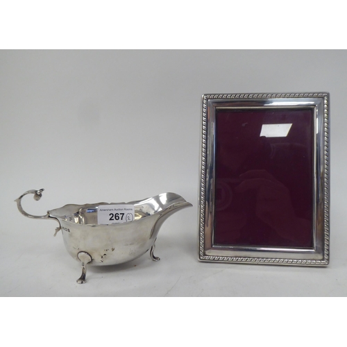 267 - A silver sauce boat; and a silver plated photograph frame  3