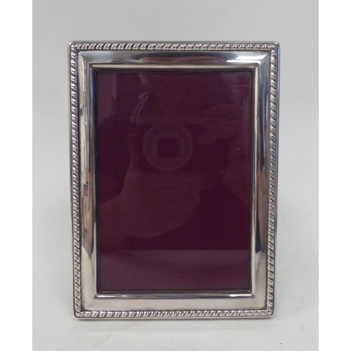 267 - A silver sauce boat; and a silver plated photograph frame  3