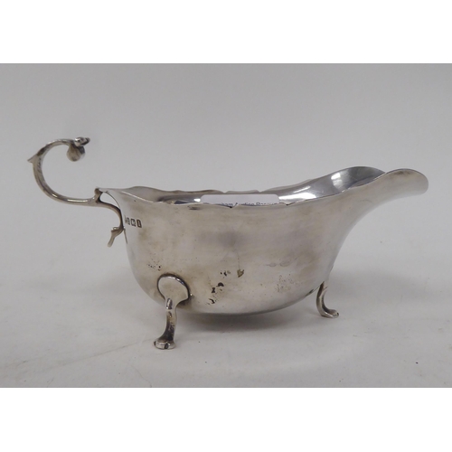 267 - A silver sauce boat; and a silver plated photograph frame  3