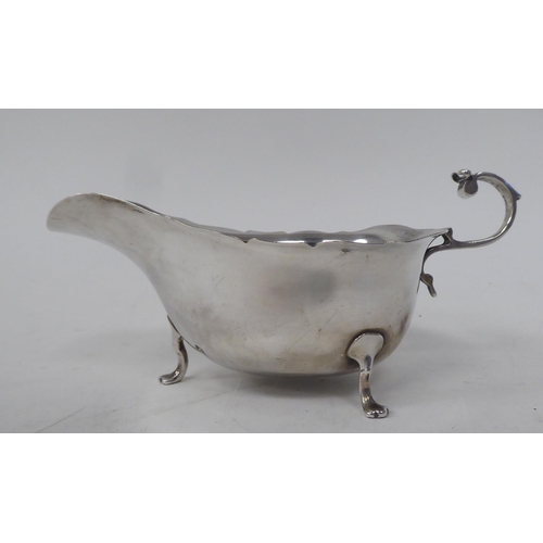 267 - A silver sauce boat; and a silver plated photograph frame  3