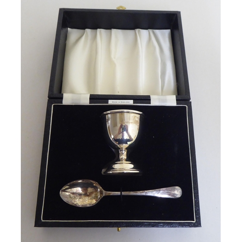 319 - Silver collectables: to include a presentation Christening egg cup and spoon  mixed marks ... 