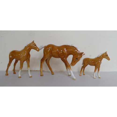 320 - A group of five Beswick china horses/foals, each in brown tan with white  manes  largest 6... 