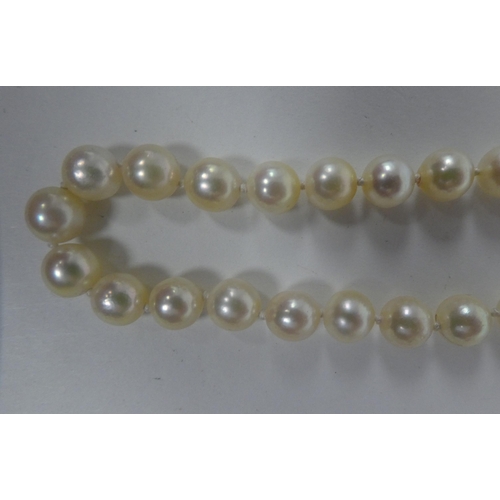 68 - Two single strand pearl necklaces, on 9ct gold clasps