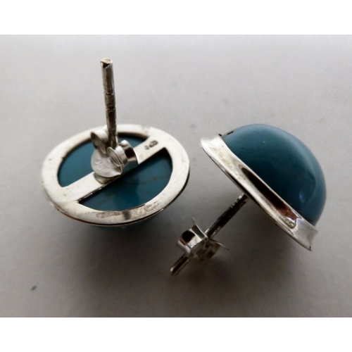 87 - A pair of silver coloured metal turquoise set stud earrings  stamped 925 