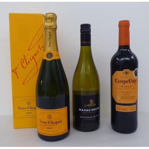 91 - Wine: a bottle of Veuve Cliquot Brut and nine other bottles of red and white wine