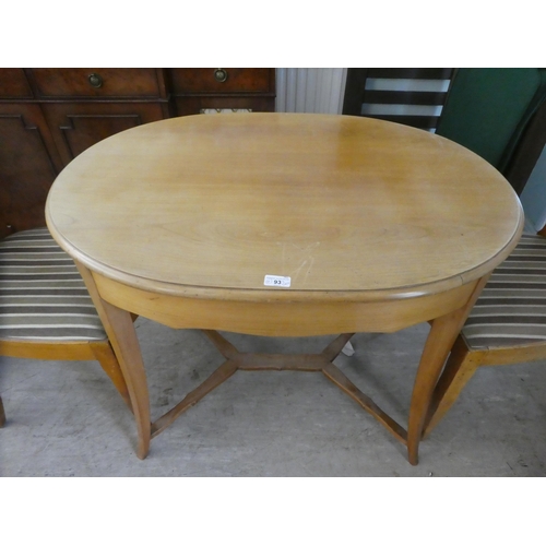 93 - A 20thC bleached wood oval centre table, raised on splayed legs  29