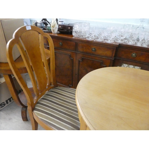 93 - A 20thC bleached wood oval centre table, raised on splayed legs  29