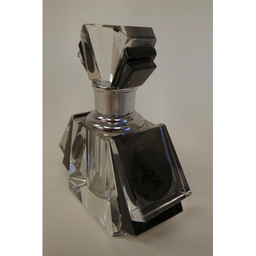 97 - An Art Deco inspired black enamel and clear glass scent bottle and stopper 