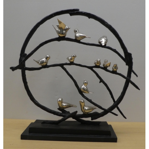 13 - A modern cast bronze and silvered metal sculpture, fashioned as eleven small birds on branches, on a... 