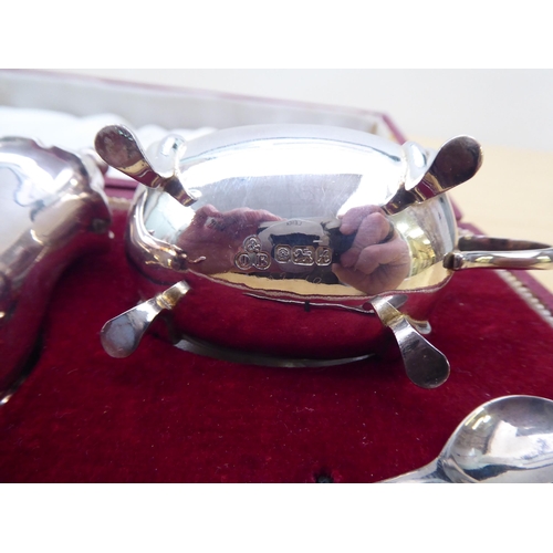 2 - A three piece silver condiments set  comprising a pepper pot, salt and mustard pot  Sheffield marks ... 