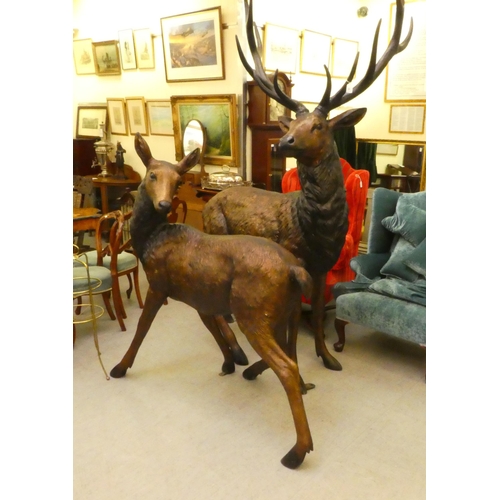 26 - A modern cast bronze model, a one piece stag  94