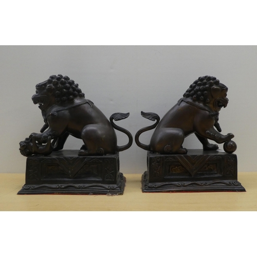 3 - A pair of modern cast bronze Dogs of Fo, on fixed plinths  12