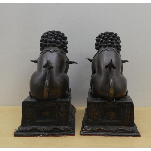 3 - A pair of modern cast bronze Dogs of Fo, on fixed plinths  12