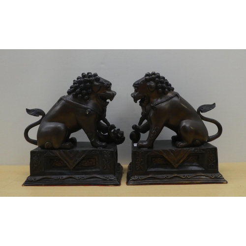 3 - A pair of modern cast bronze Dogs of Fo, on fixed plinths  12