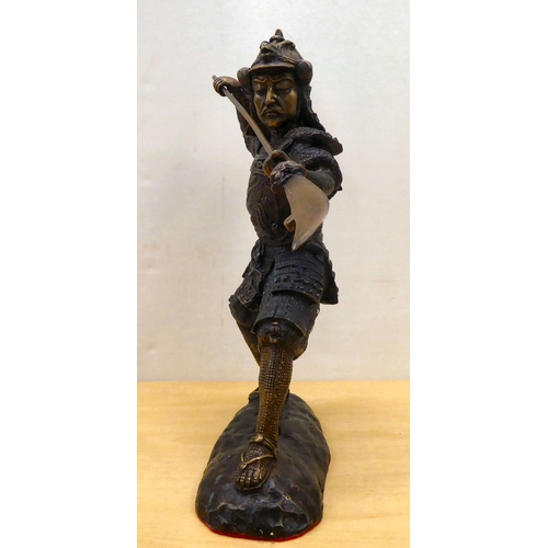 49 - A cast bronze model, a Samurai warrior with a separate long sword  18