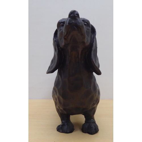 57 - A cast bronze model, a dachshund  7