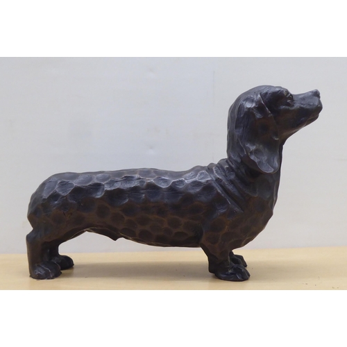 57 - A cast bronze model, a dachshund  7