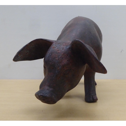 60 - A cast bronze model, a piglet  6.5