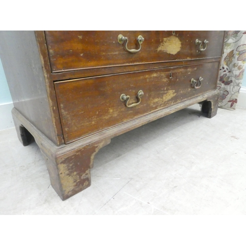 7 - A 19thC mahogany bureau, the fall flap over two short/three graduated long drawers, raised on bracke... 