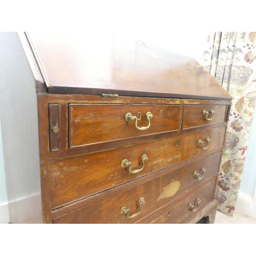 7 - A 19thC mahogany bureau, the fall flap over two short/three graduated long drawers, raised on bracke... 