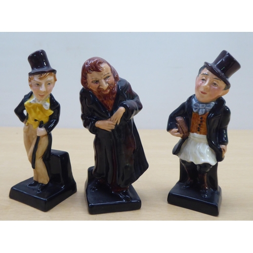 75 - Twenty-four Royal Doulton china figures from 'Oliver' and other Dickens figures  largest 4