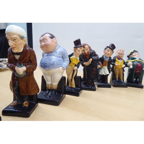 75 - Twenty-four Royal Doulton china figures from 'Oliver' and other Dickens figures  largest 4