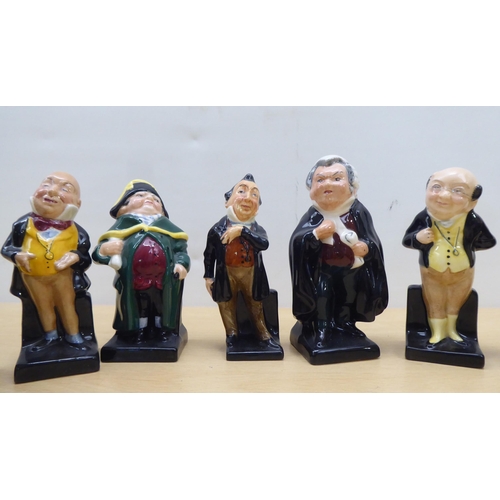 75 - Twenty-four Royal Doulton china figures from 'Oliver' and other Dickens figures  largest 4