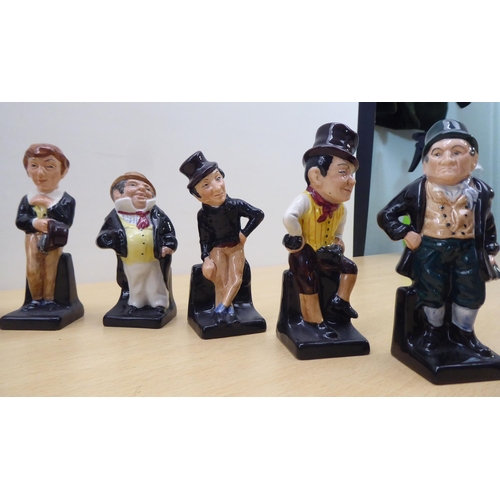 75 - Twenty-four Royal Doulton china figures from 'Oliver' and other Dickens figures  largest 4