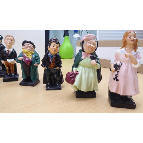 75 - Twenty-four Royal Doulton china figures from 'Oliver' and other Dickens figures  largest 4