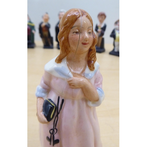 75 - Twenty-four Royal Doulton china figures from 'Oliver' and other Dickens figures  largest 4