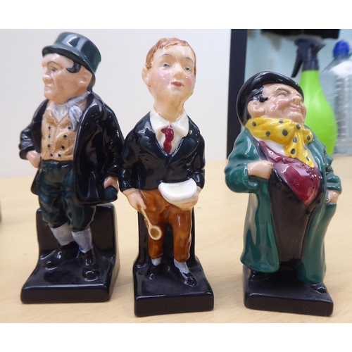 75 - Twenty-four Royal Doulton china figures from 'Oliver' and other Dickens figures  largest 4