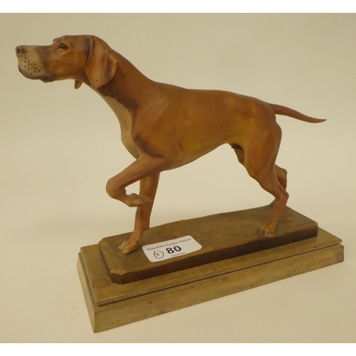 80 - A carved softwood sculpture, a gun dog, on a plinth  bears the signature Diller  6